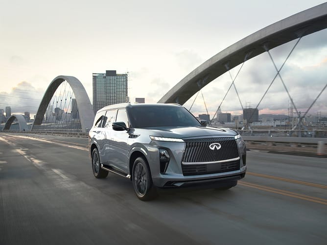 2026 INFINITI QX80 AUTOGRAPH driving on bridge