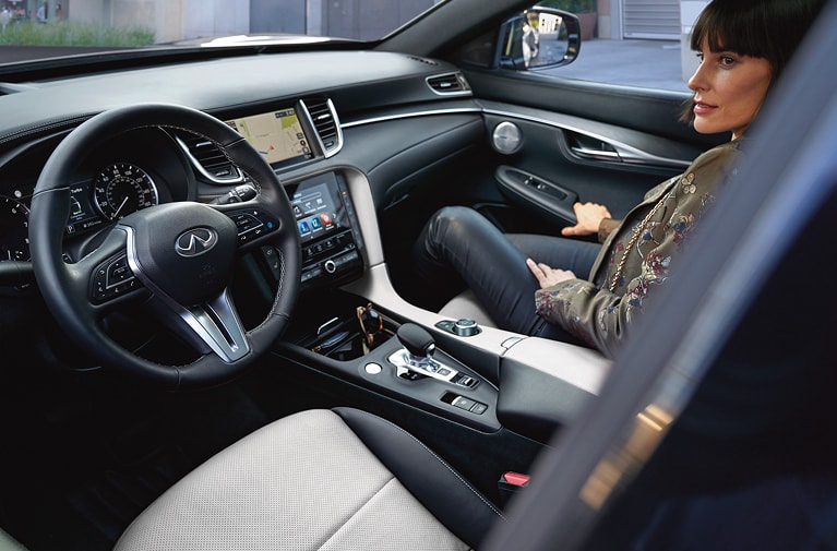 woman in the passenger seat of an INFINITI