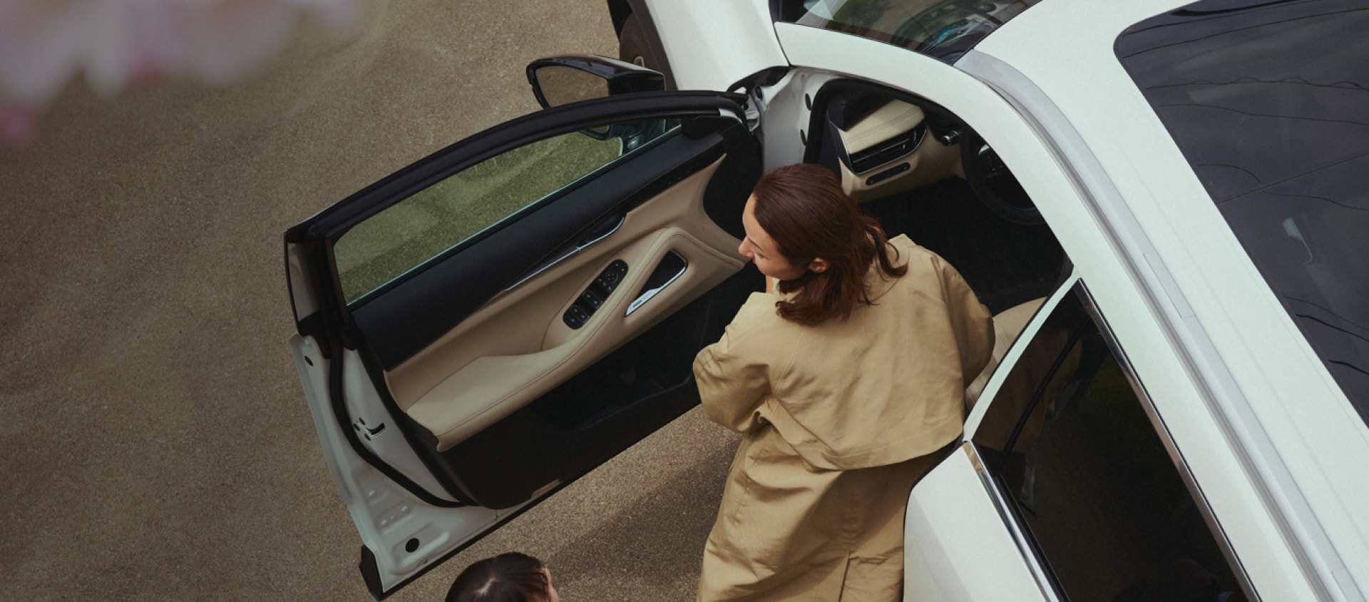Woman getting out of car.