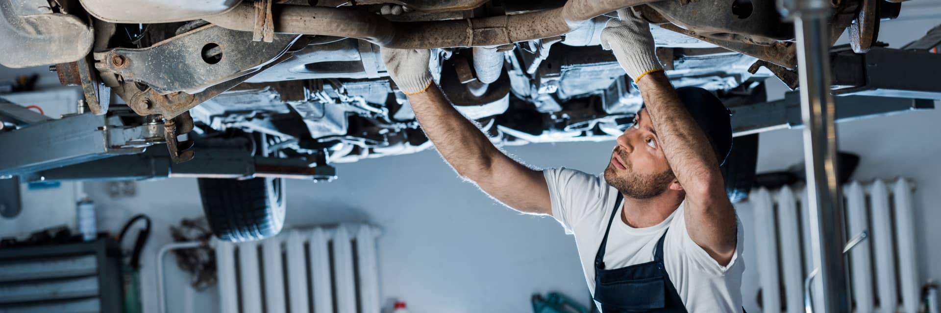service specialist working under vehicle