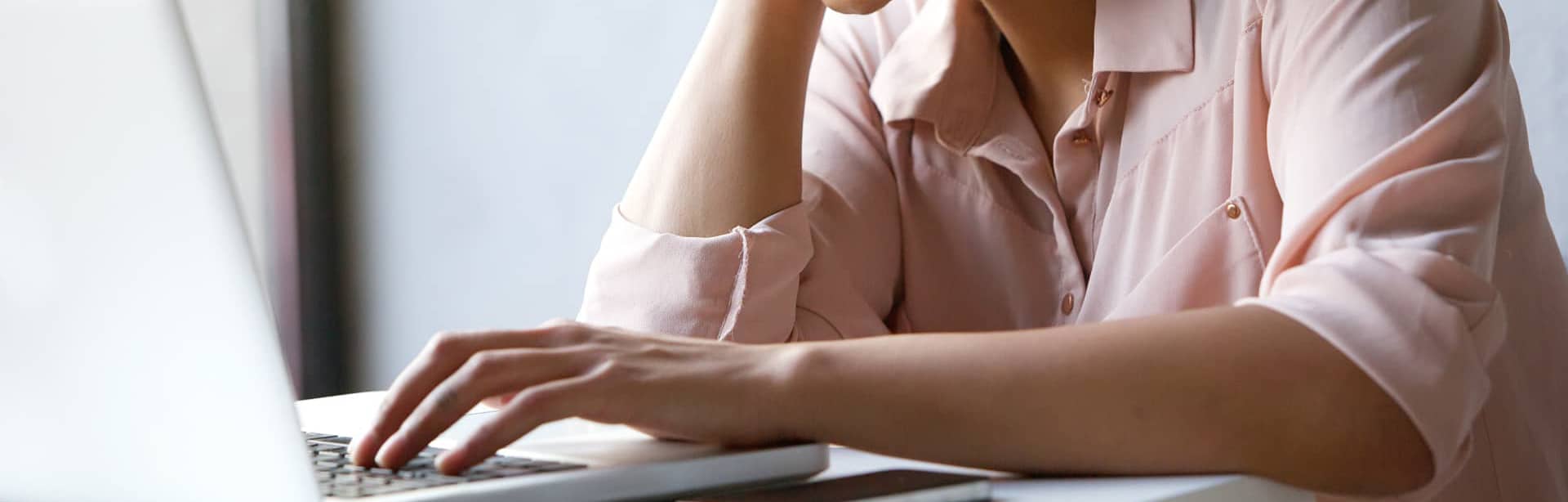 woman looking at a laptop