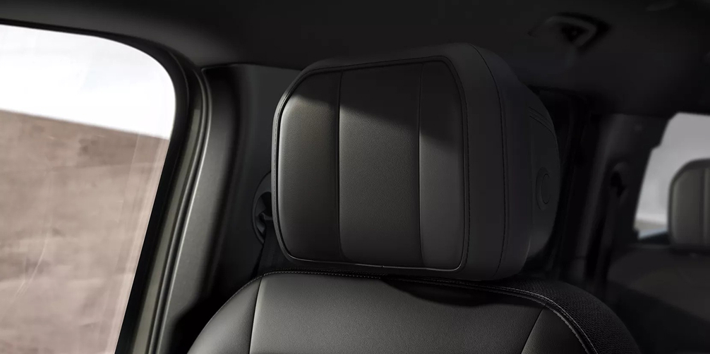 Defender 130 interior close up view of the front seat head rest