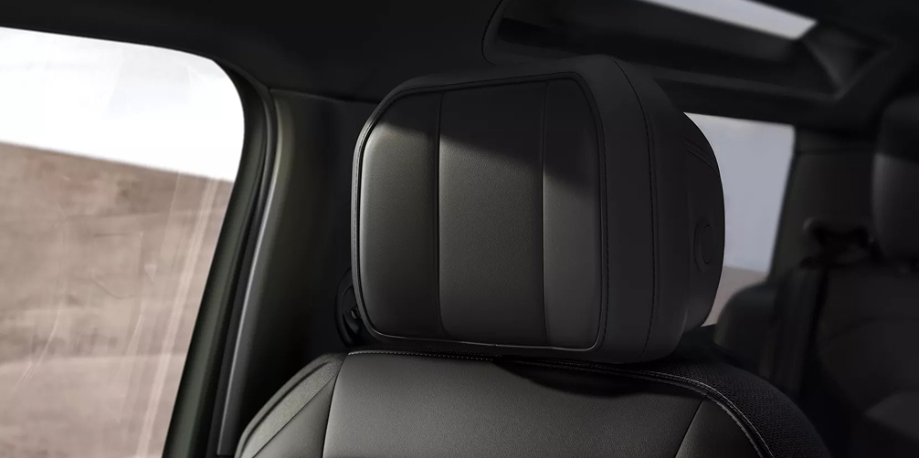 Defender 90 close up interior shot of the front bucket seat head rest