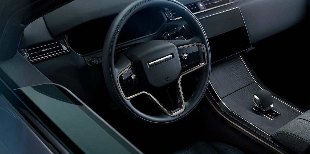 Range Rover Velar interior view of the steering wheel, dashboard, and center console