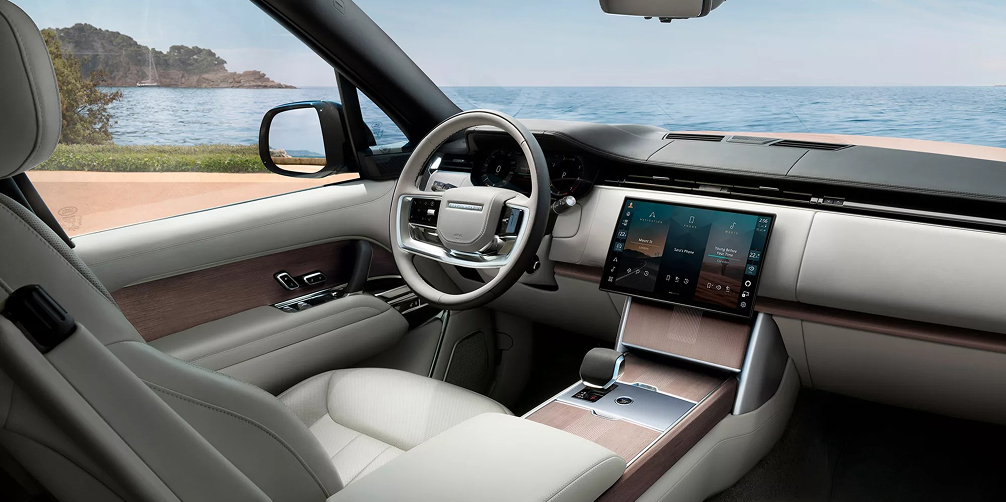 Range Rover interior angled view of the front dashboard and driver's seat