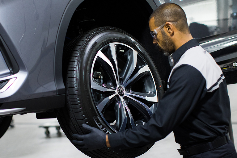 Lexus service technician enhancing a vehicle