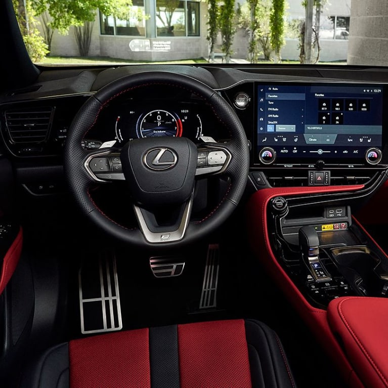 Interior shot of a Lexus vehicle, including the steering wheel and dashboard