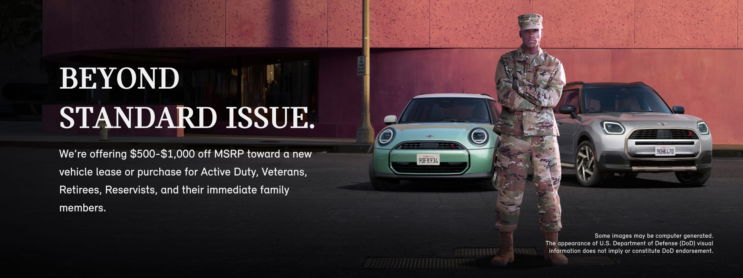 A man in a military uniform standing in front of a 2025 MINI Cooper S 2 Door and MINI Countryman S ALL4 with his arms crossed.