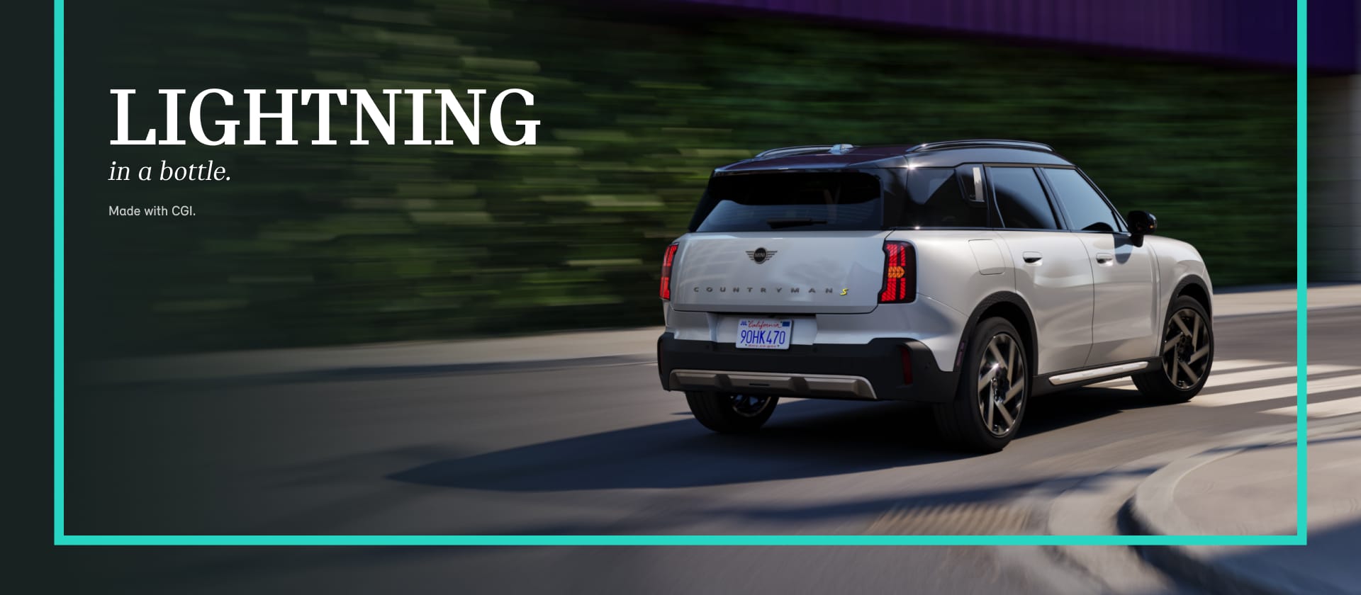 A MINI Countryman SE ALL4 cruises down a road.