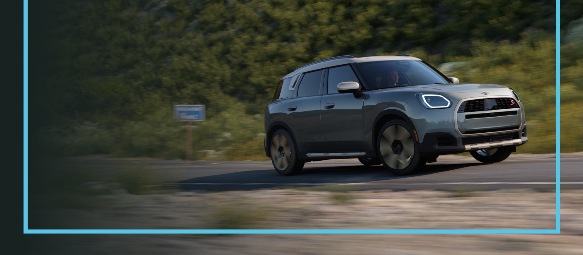  MINI Countryman S ALL4 cruising down a road. 