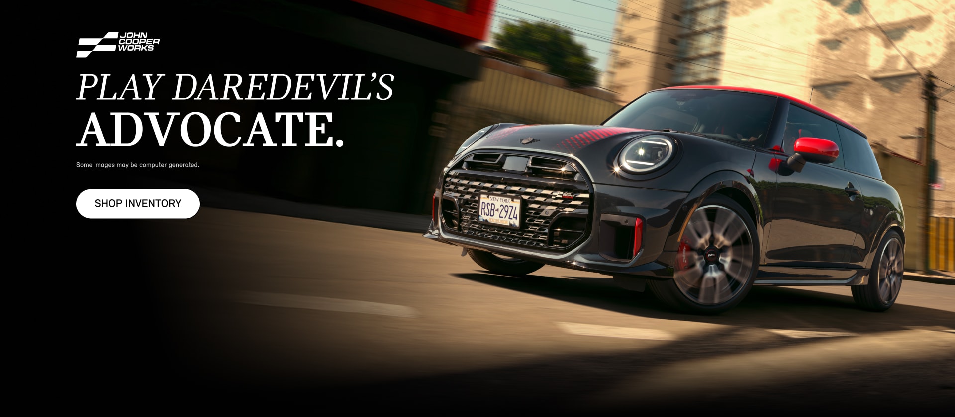 A MINI JCW 2 Door cruising down a street.