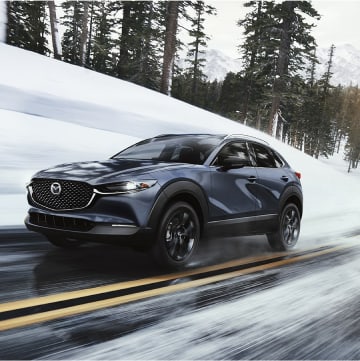2022 Mazda CX-30 driving through snow