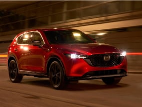 Red 2022 Mazda CX-5 driving at night