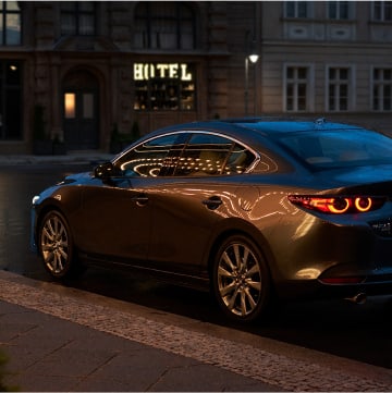 2024 Mazda 3 Sedan parked on a city street at night