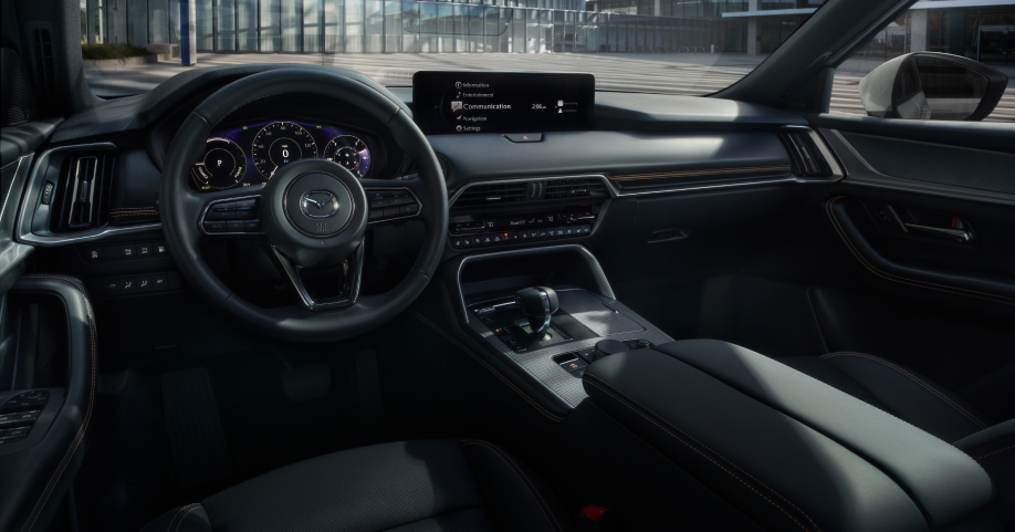 Mazda CX-90 PHEV steering wheel and front view. 