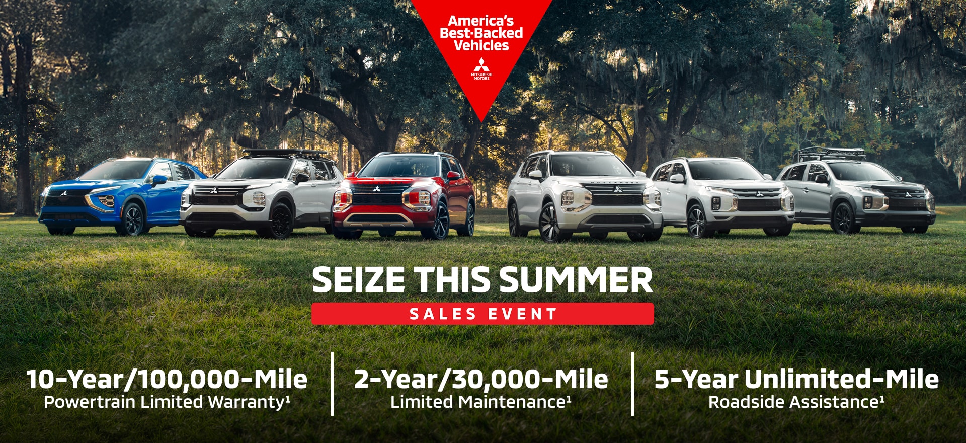 Six Mitsubishi SUVs parked in a field