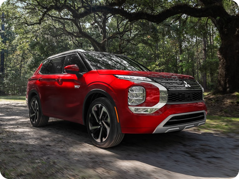 Red Mitsubishi Outlander Plug-in Hybrid low angle side profile