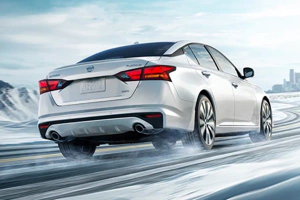 Nissan Altima driving in the snow