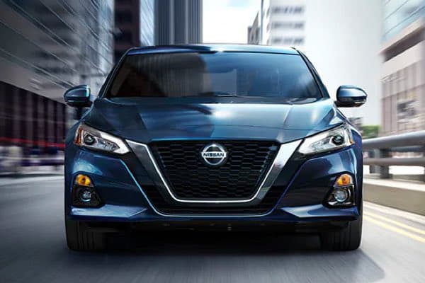 Nissan Altima driving towards camera