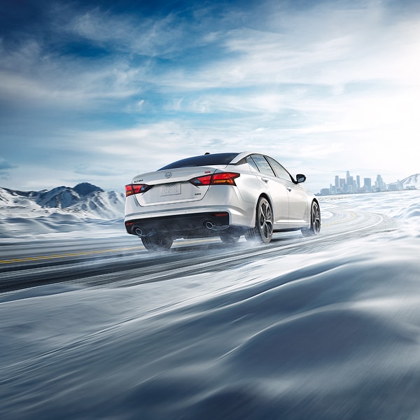 Nissan Altima driving in snowy conditions