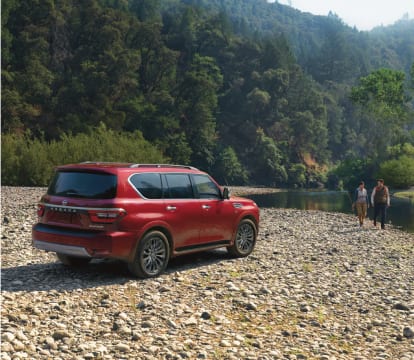 2023 Nissan Armada parked near a mountain lake