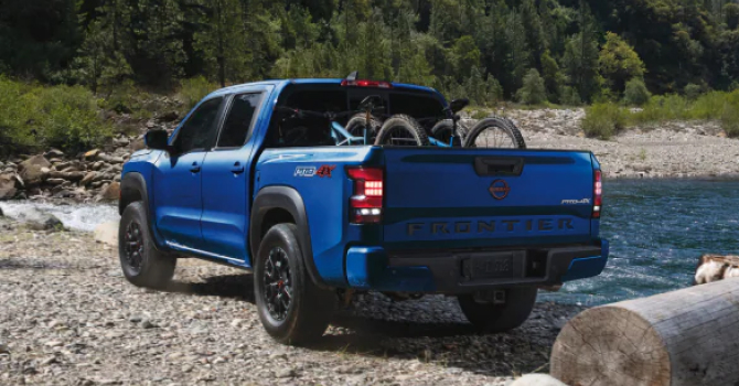 2023 Nissan Frontier next to lake
