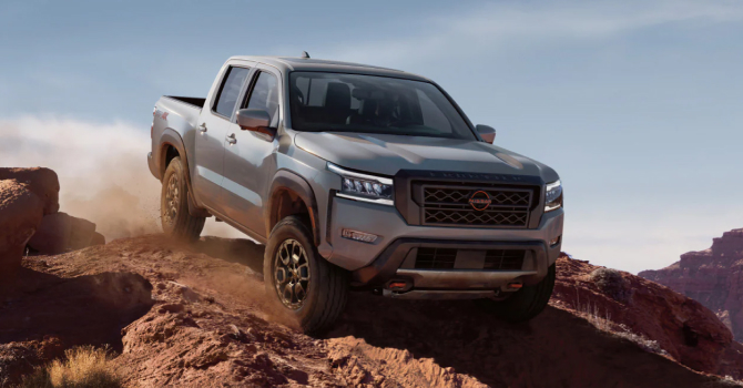 2023 Nissan Frontier going downhill on a dirt road