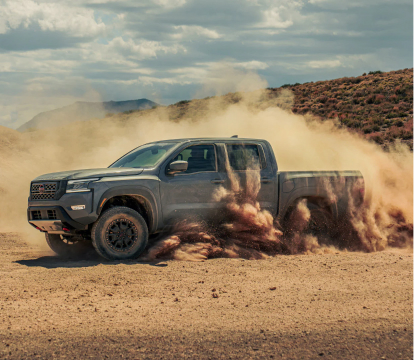 2023 Nissan Frontier drifting in the desert sand