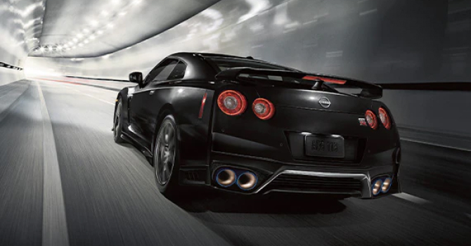 Black 2023 Nissan GT-R driving through a tunnel