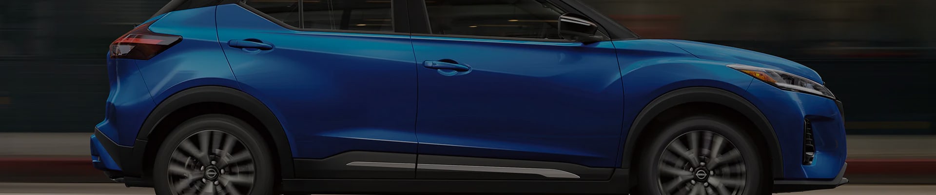 Closeup profile of an Electric Blue 2023 Nissan Kickx