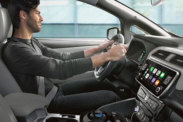 Guy driving Nissan LEAF
