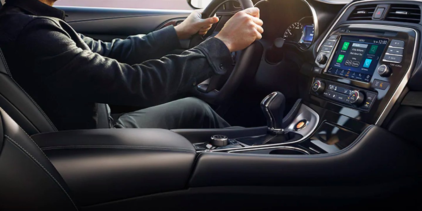 Interior view of a man driving a 2021 Nissan Maxima
