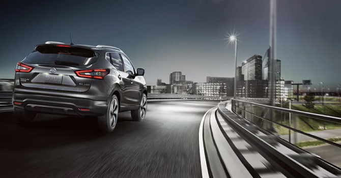 2022 Nissan Rogue Sport driving on a highway at night