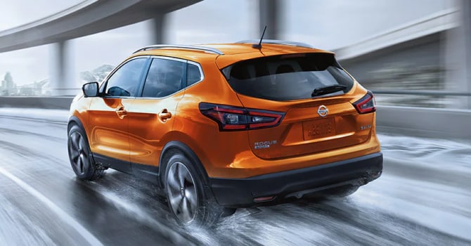 Orange Rogue Sport driving in the rain