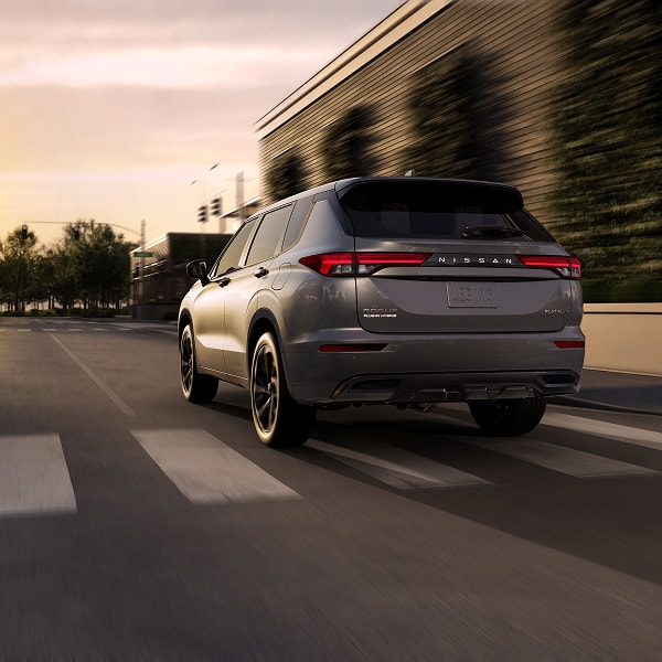 Nissan Rogue PHEV driving on a city street