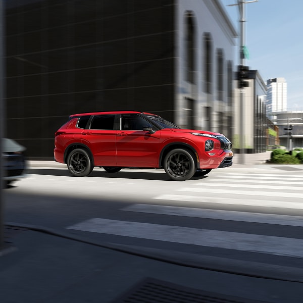 Nissan Rogue PHEV driving in a city