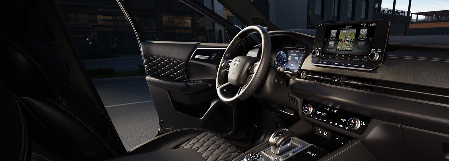 interior of Nissan Rogue with an open driver door