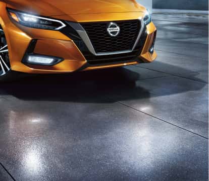 Orange Nissan Sentra headlights and grill