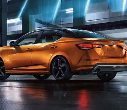 Rear angle image of Orange Nissan Sentra