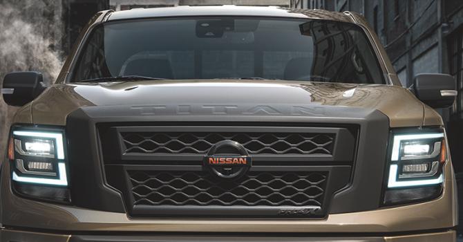 2023 Nissan Titan XD offroading on a sandy hill