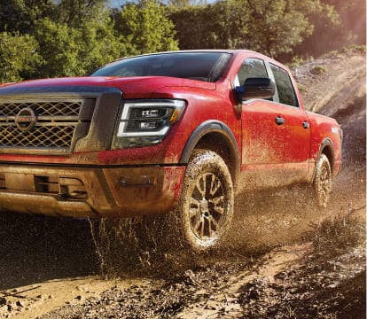 2023 Nissan Titan off-roading in mud