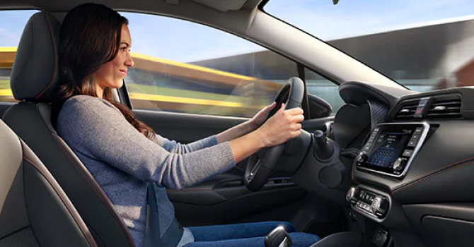 Interior view of person driving Nissan Versa