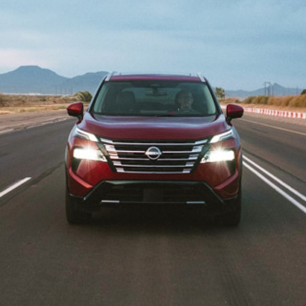 front view of a Nissan Rogue on the highway