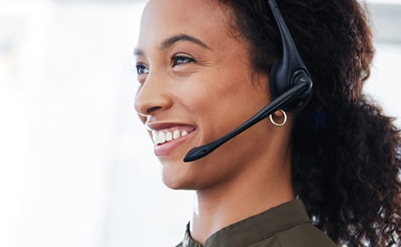 Woman smiling with headset on.