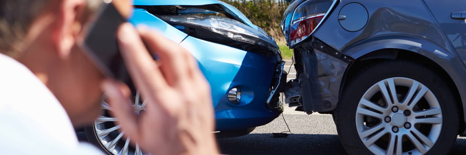 person talking on cellphone after accident