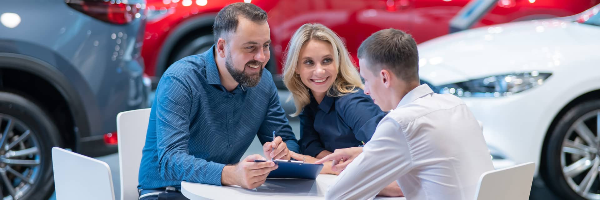 couple signing papers with finance specialist