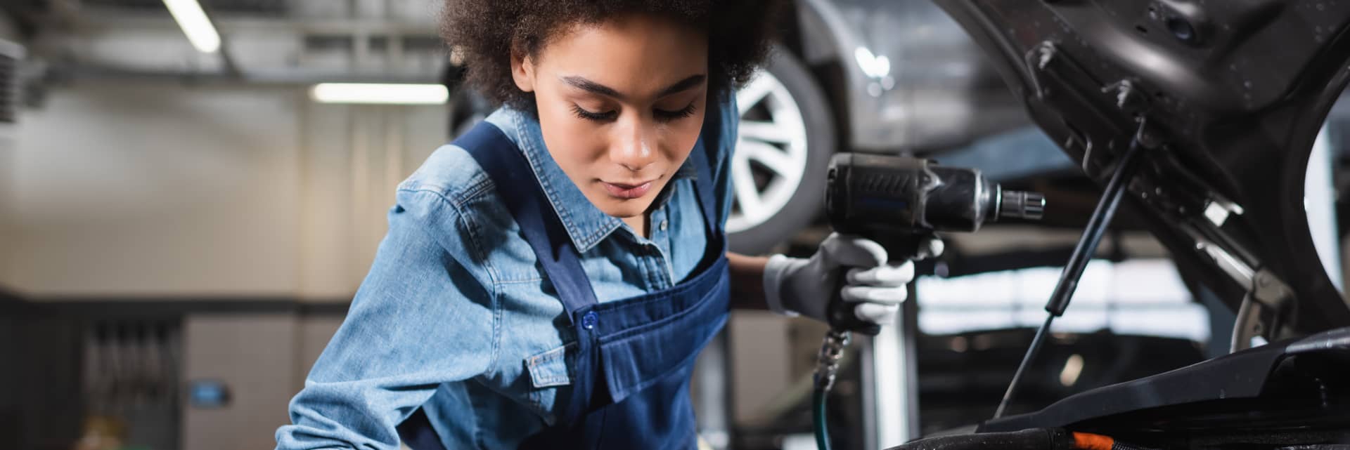 service person working on vehicle