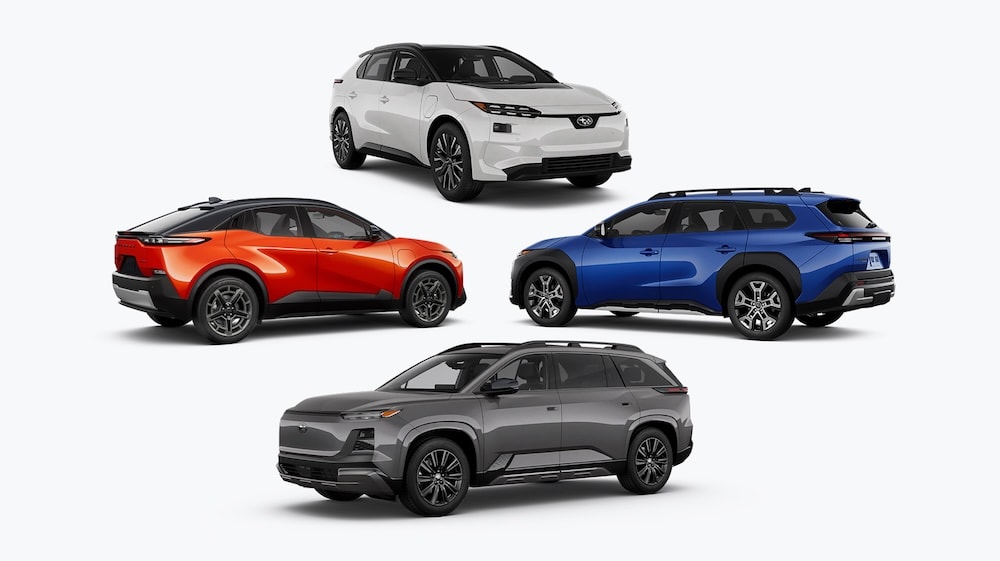 Four Subaru electric vehicles.