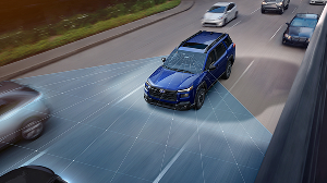 A Subaru SUV project lines on the road, representing EyeSight Driver Assist Technology
