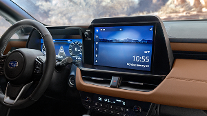 A Subaru Multimedia in-dash touchscreen, steering wheel, and center console